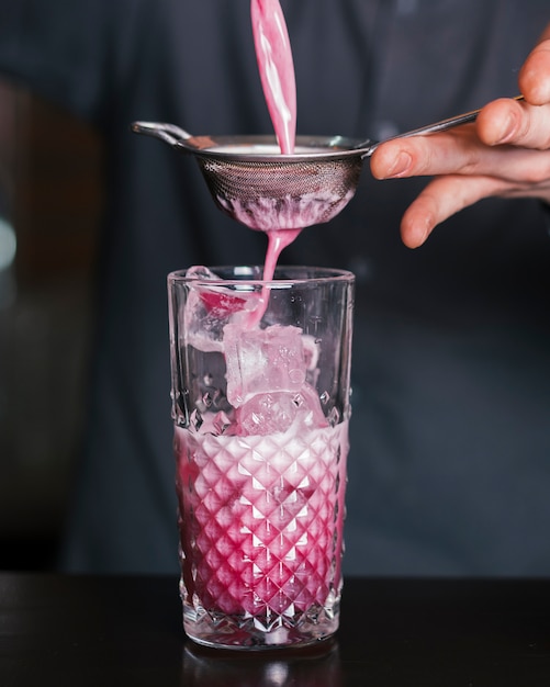 Bartender preparing a refreshing cocktail