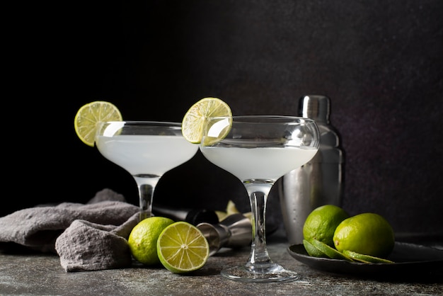 Blend of cocktails in glasses with limes